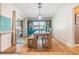 Dining room with a large built-in teal hutch and wood floors at 2240 Colonial Dr, Dunedin, FL 34698