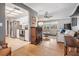 Open living room and kitchen with hardwood floors at 2240 Colonial Dr, Dunedin, FL 34698