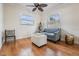 Living Room with hardwood floors, ceiling fan, and gray couch at 2240 Colonial Dr, Dunedin, FL 34698