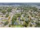Wide aerial shot of a residential area with lush trees, homes, roadways and nearby commercial spots at 2729 36Th N Ave, St Petersburg, FL 33713
