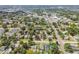 Aerial view of tree-lined street, showing well-kept neighborhood of diverse homes and commercial area nearby at 2729 36Th N Ave, St Petersburg, FL 33713