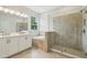 New bathroom features a walk-in glass shower and separate tub with tile surround at 2729 36Th N Ave, St Petersburg, FL 33713