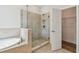 Bathroom featuring a tiled shower, soaking tub and access to a closet at 2729 36Th N Ave, St Petersburg, FL 33713