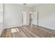 Bedroom features wood-look floors, white walls, and two large doorways at 2729 36Th N Ave, St Petersburg, FL 33713