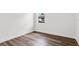 Minimalist bedroom with hardwood floors and plenty of natural light at 2729 36Th N Ave, St Petersburg, FL 33713