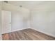 Light-filled bedroom with wood-look flooring, neutral walls, and modern fixtures, perfect for relaxation at 2729 36Th N Ave, St Petersburg, FL 33713