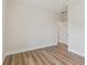 Bright bedroom features modern wood-look flooring, white walls, and an open doorway at 2729 36Th N Ave, St Petersburg, FL 33713