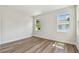 Bedroom features wood-look floors, white walls, and large windows at 2729 36Th N Ave, St Petersburg, FL 33713