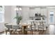 Comfortable dining area with seating for six adjacent to kitchen with matching counter stools at 2729 36Th N Ave, St Petersburg, FL 33713
