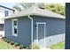 A quaint one story, blue house with white trim, nice lawn and mature trees at 2729 36Th N Ave, St Petersburg, FL 33713