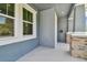 Cozy front porch with stone columns, offering a perfect spot to relax and enjoy the neighborhood views at 2729 36Th N Ave, St Petersburg, FL 33713