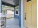 Inviting front porch featuring stylish stone pillars and a bright yellow front door at 2729 36Th N Ave, St Petersburg, FL 33713