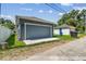 Detached garage with well-manicured lawn, providing functionality and aesthetic appeal to the property at 2729 36Th N Ave, St Petersburg, FL 33713