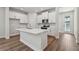 Modern kitchen with white cabinetry, stainless steel appliances, and a large center island at 2729 36Th N Ave, St Petersburg, FL 33713