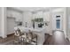 Modern kitchen island boasts stylish seating, sleek white cabinets and stainless appliances at 2729 36Th N Ave, St Petersburg, FL 33713