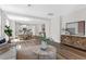 Open-concept living and dining area with wood floors and modern decor throughout the spacious layout at 2729 36Th N Ave, St Petersburg, FL 33713