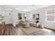 Bright living room boasts neutral tones, stylish decor, wood floors, and abundant natural light at 2729 36Th N Ave, St Petersburg, FL 33713