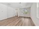 Bright living room featuring hardwood floors, white walls and trim, and large windows at 2729 36Th N Ave, St Petersburg, FL 33713