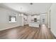 Open-concept living room with hardwood floors flowing into the kitchen at 2729 36Th N Ave, St Petersburg, FL 33713