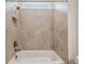 A well-lit shower-tub combo featuring neutral-toned tile surround, built-in niche and modern showerhead at 2729 36Th N Ave, St Petersburg, FL 33713