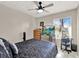 Serene bedroom with a queen bed, dresser and large window at 3869 S Lake Dr # 146, Tampa, FL 33614