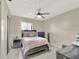 Cozy bedroom with a queen bed, nightstands, and mirrored closet at 3869 S Lake Dr # 146, Tampa, FL 33614