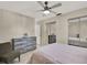 Comfortable bedroom with a queen bed, dresser, and mirrored closet at 3869 S Lake Dr # 146, Tampa, FL 33614
