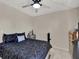 Simple bedroom with a queen bed and dresser at 3869 S Lake Dr # 146, Tampa, FL 33614