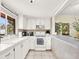 Bright white kitchen features ample cabinetry and modern appliances at 3869 S Lake Dr # 146, Tampa, FL 33614
