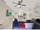 Open living room, featuring a sectional sofa and large TV at 3869 S Lake Dr # 146, Tampa, FL 33614