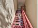 Indoor condo stairwell with red railings at 3869 S Lake Dr # 146, Tampa, FL 33614