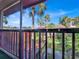 Scenic balcony view of a peaceful canal with lush landscaping and palm trees at 3869 S Lake Dr # 146, Tampa, FL 33614