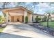 Tan single-story house with carport and landscaping at 5110 28Th W St, Bradenton, FL 34207