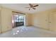 Charming bedroom with window, ceiling fan, and closets at 1510 Ingram Dr, Sun City Center, FL 33573