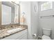 Clean bathroom with granite countertop and updated fixtures at 1820 47Th N Ave, St Petersburg, FL 33714