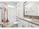 Clean bathroom, granite countertop, bathtub, and shower at 1820 47Th N Ave, St Petersburg, FL 33714