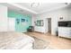 Relaxing bedroom with teal accent wall, ample closet space, and hardwood floors at 1820 47Th N Ave, St Petersburg, FL 33714