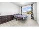 Bedroom with floral bedding and a dark wood dresser at 1820 47Th N Ave, St Petersburg, FL 33714