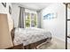Bright bedroom with large window and plush bed at 1820 47Th N Ave, St Petersburg, FL 33714