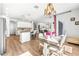 Bright dining area with chandelier and access to the kitchen at 1820 47Th N Ave, St Petersburg, FL 33714