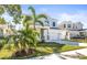 Two-story house with palm trees and a grassy lawn at 1820 47Th N Ave, St Petersburg, FL 33714