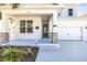 Covered porch with stone pillars and a gray front door at 1820 47Th N Ave, St Petersburg, FL 33714