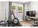 Home gym with elliptical, tv, and plenty of floor space at 1820 47Th N Ave, St Petersburg, FL 33714