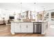 Modern kitchen featuring a large island and stainless steel dishwasher at 1820 47Th N Ave, St Petersburg, FL 33714