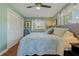 Bright bedroom with a ceiling fan and plenty of natural light at 1957 Temple Ter, Clearwater, FL 33764