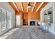 Bright living room featuring a wood-burning fireplace and wood accent walls at 2027 Inner S Cir, St Petersburg, FL 33712