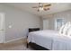 Bright bedroom with a king-size bed and ample closet space at 24839 Panacea Ct, Lutz, FL 33559