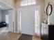 Home entry featuring a white door and view into an adjacent room at 24839 Panacea Ct, Lutz, FL 33559