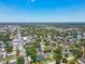 Spacious aerial view of a community featuring tree-lined streets, roadways and blue skies at 2735 36Th N Ave, St Petersburg, FL 33713