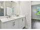 Bathroom featuring double vanity with stone countertop, and tiled walk-in shower at 2735 36Th N Ave, St Petersburg, FL 33713